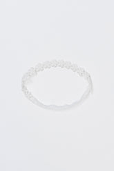 Avauma White Garden Band headband in Pure White with embroidered daisy flowers, laid flat